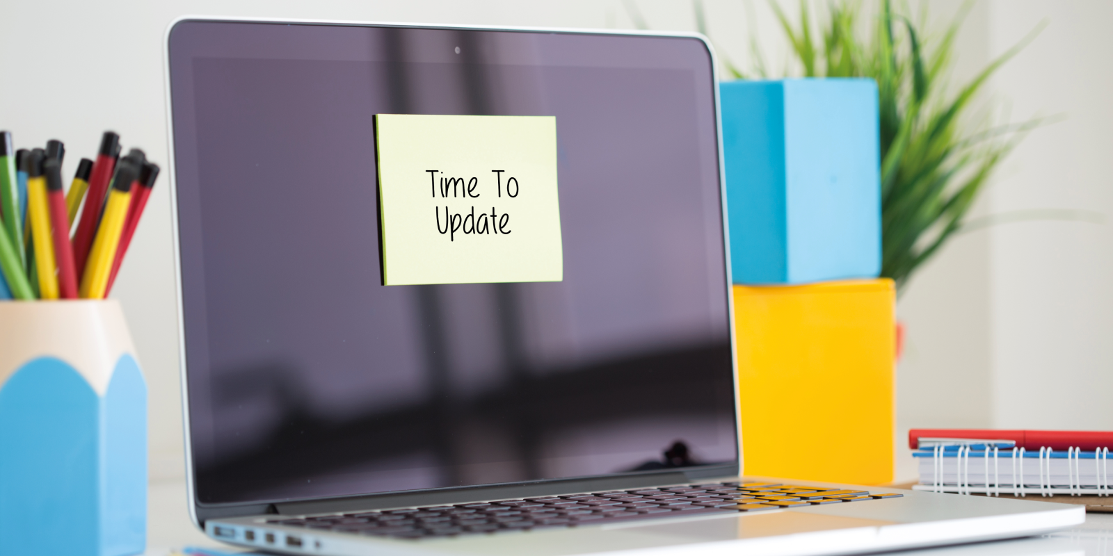 computer screen with a sticky note on it saying featured_image